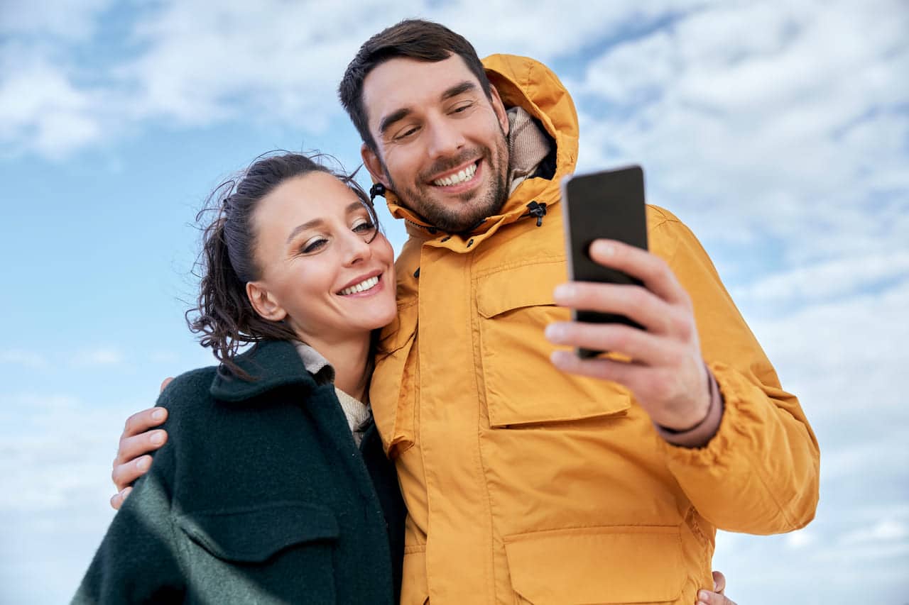 Couple taking a selfie outdoors together