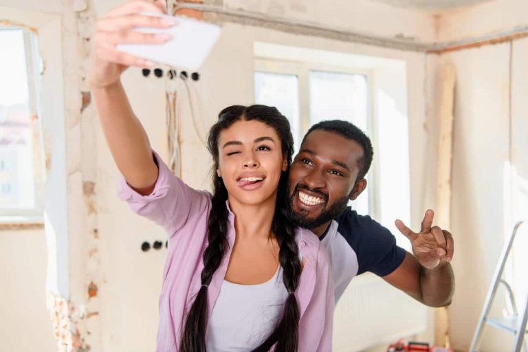 Couple taking a selfie during home renovation