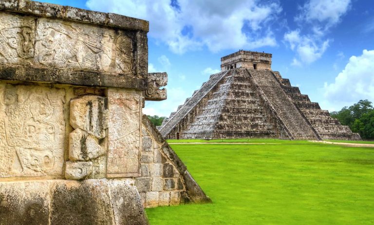 A large stone pyramid with detailed carvings, Chichen Itza, Mexico