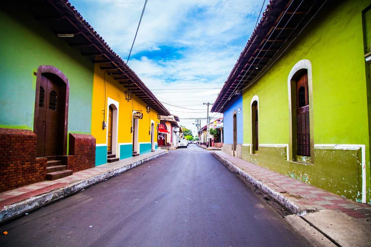 Colorful buildings along a quiet empty street