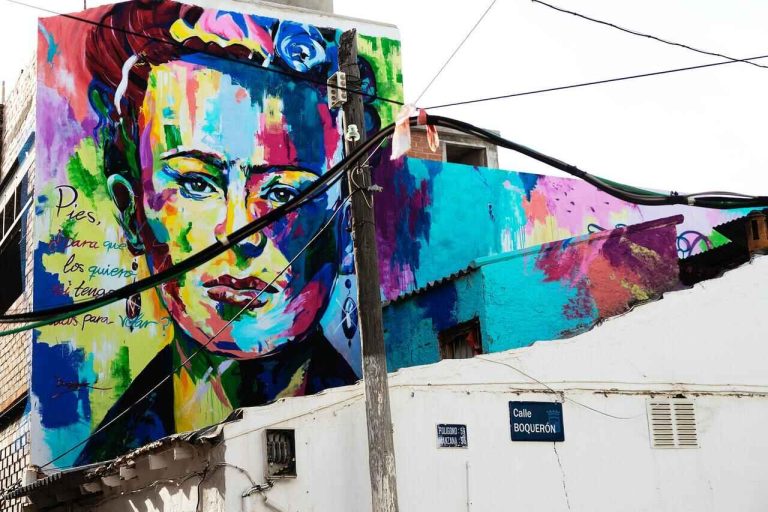 Colorful mural of Frida Kahlo on a building