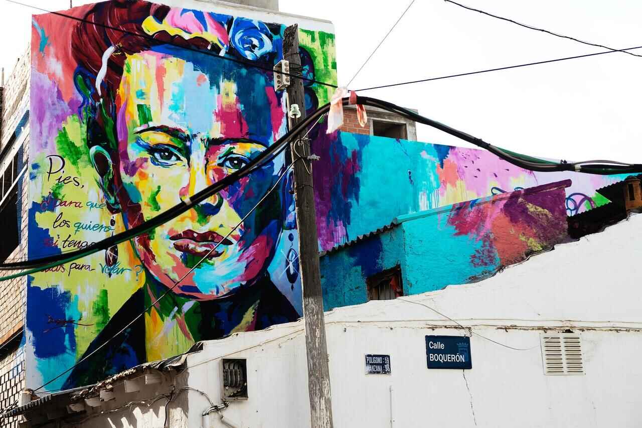 Colorful mural of Frida Kahlo on a building