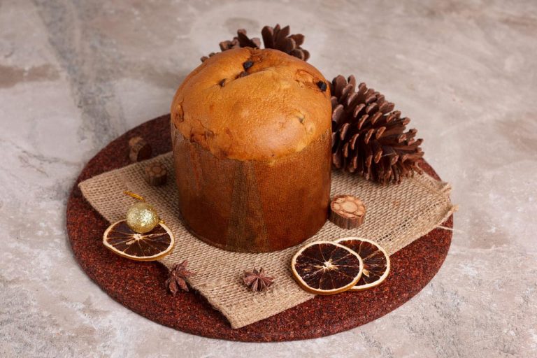 Panettone cake with dried orange slices and pinecones