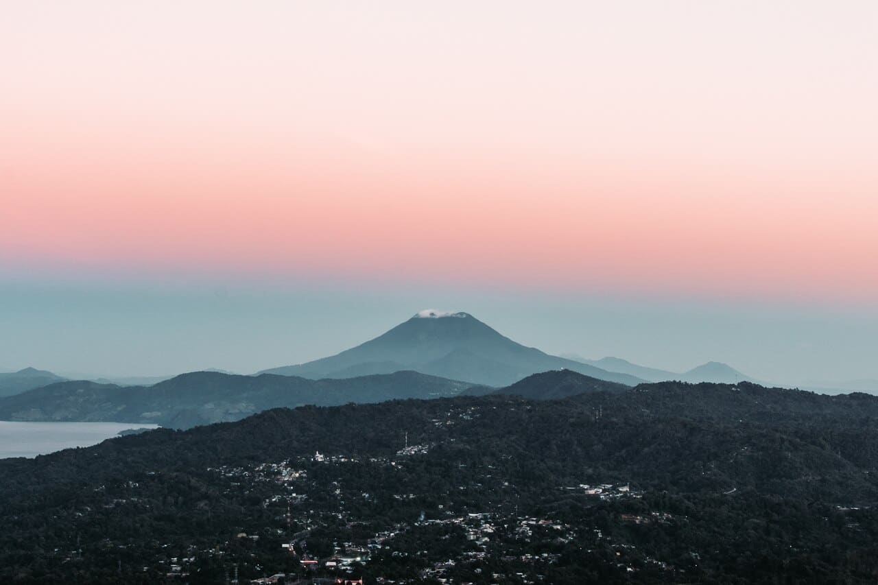 Mountain landscape at sunset with soft pastel sky