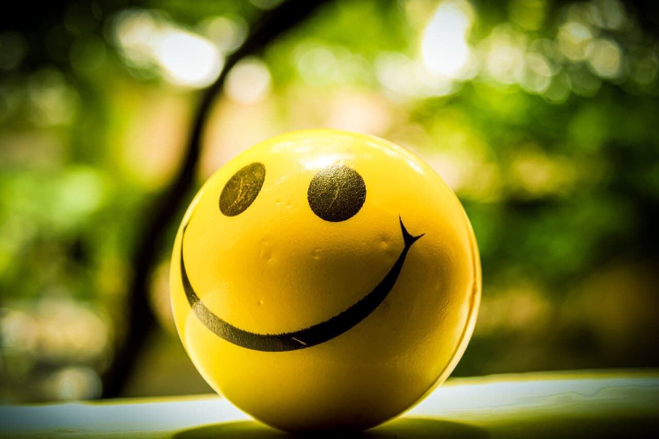 Yellow smiley face ball with blurred background