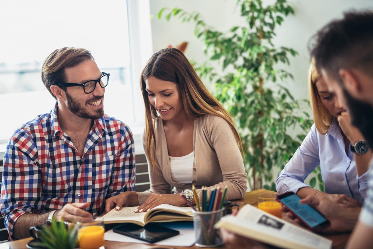 Group of people studying together at a table