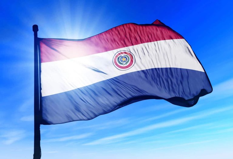 Paraguayan flag waving against a bright sky