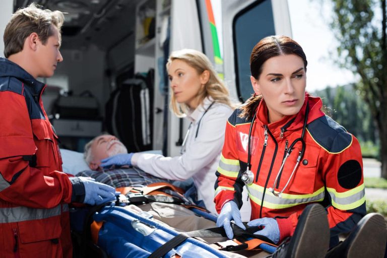 Emergency medical team assists a patient in ambulance