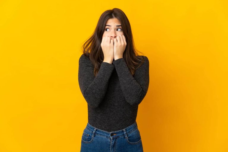Woman in black shirt looking nervous