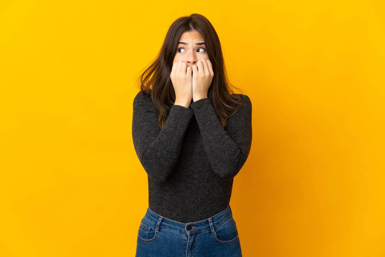 Woman in black shirt looking nervous