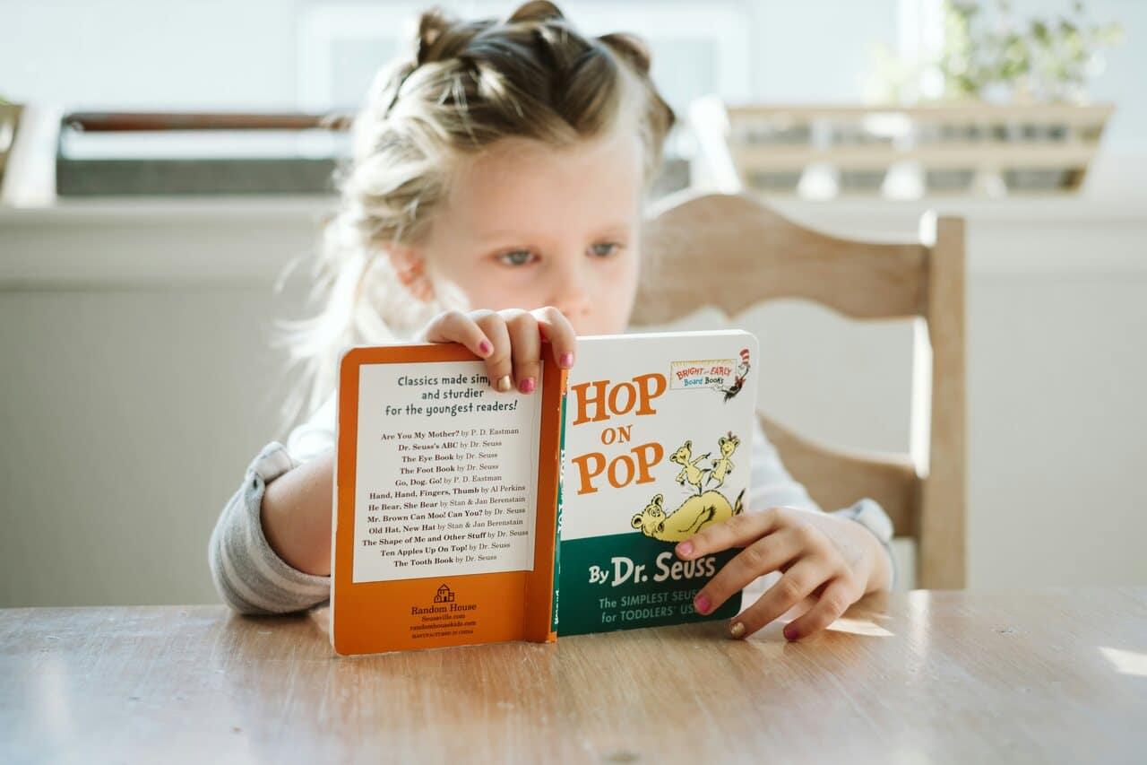 Child reading ‘Hop on Pop’ by Dr. Seuss